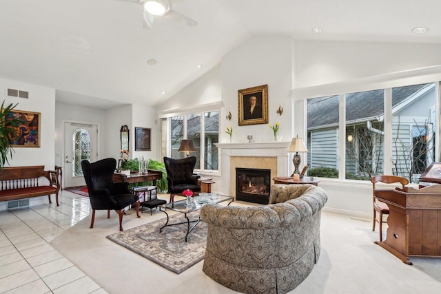 tiled living room featuring ceiling fan, high vaulted ceiling, and a healthy amount of sunlight