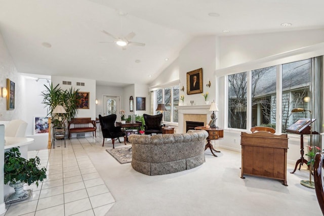 tiled living room featuring high vaulted ceiling and ceiling fan