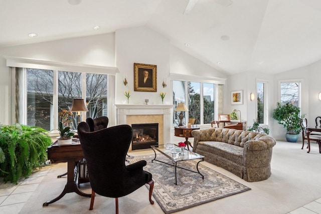 living room featuring high vaulted ceiling and light tile patterned floors