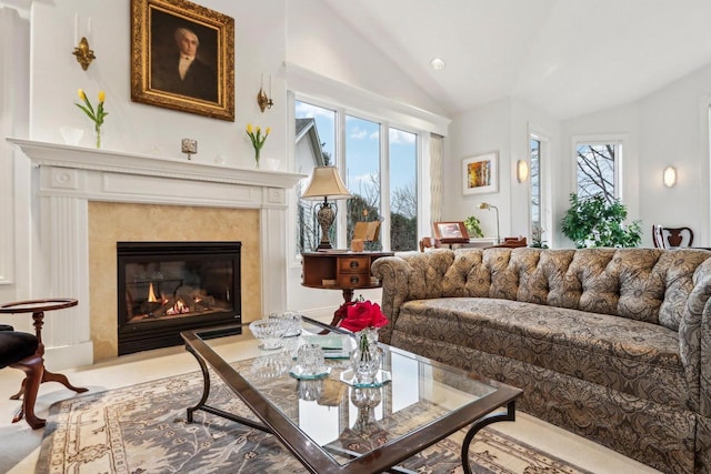 carpeted living room with lofted ceiling and a fireplace