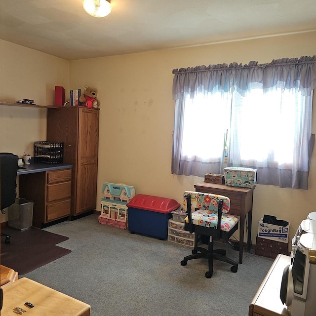 office area with plenty of natural light and carpet