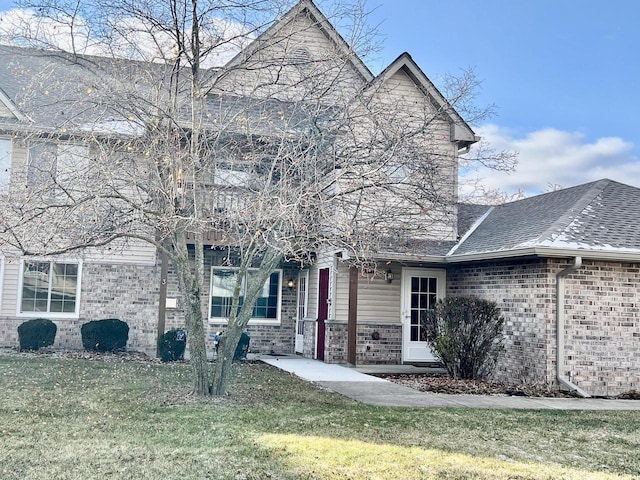 front facade with a front yard