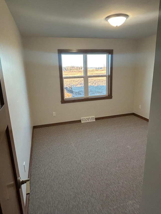 unfurnished room with carpet flooring