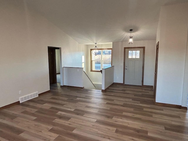 foyer entrance featuring dark hardwood / wood-style floors