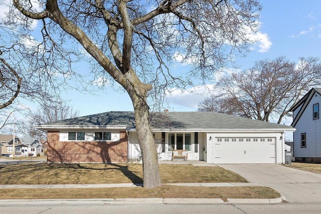 single story home featuring a garage, a front lawn, and a porch