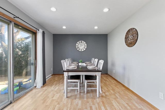 dining space with light wood-type flooring