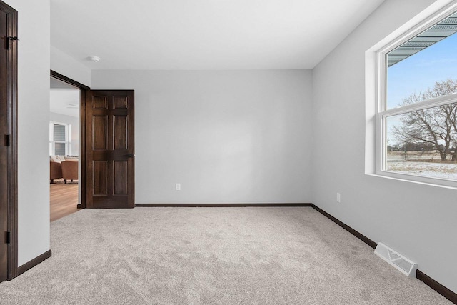 unfurnished bedroom with light carpet