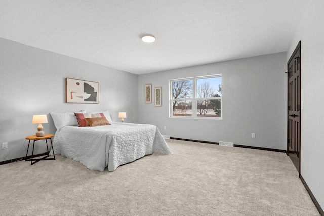 bedroom with light carpet