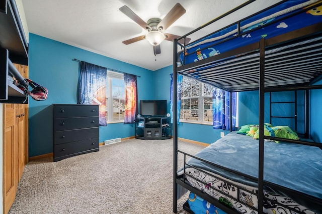 carpeted bedroom with ceiling fan