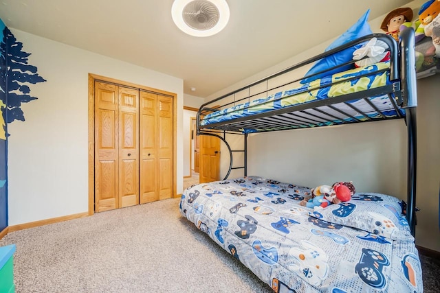 bedroom with carpet flooring and a closet