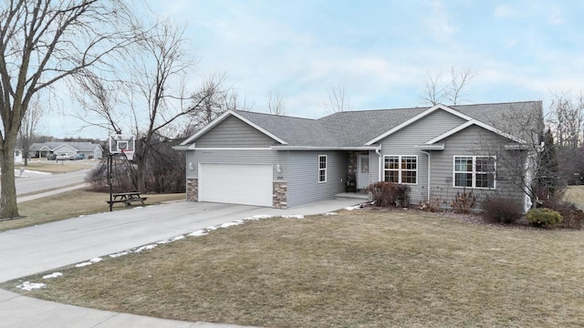 ranch-style home with a garage and a front lawn