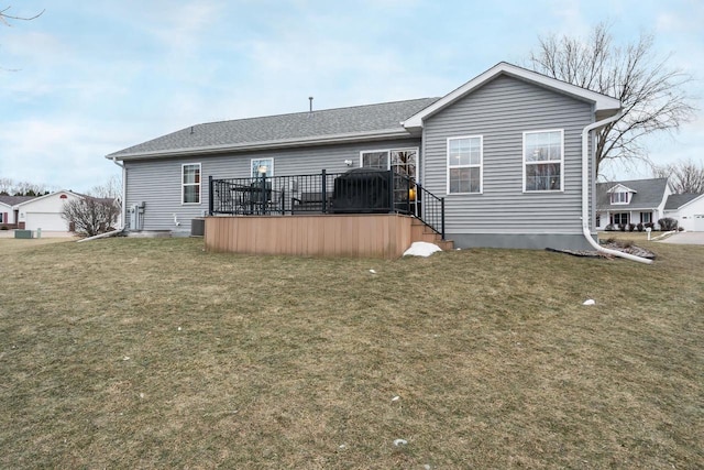 rear view of house with a lawn