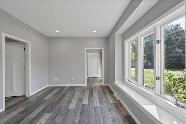 unfurnished room with dark hardwood / wood-style floors