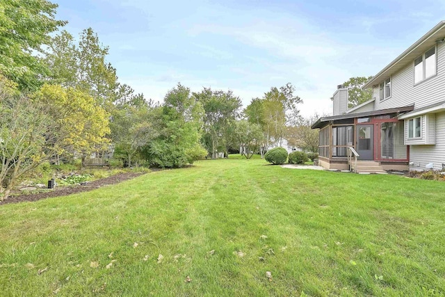 view of yard with a sunroom