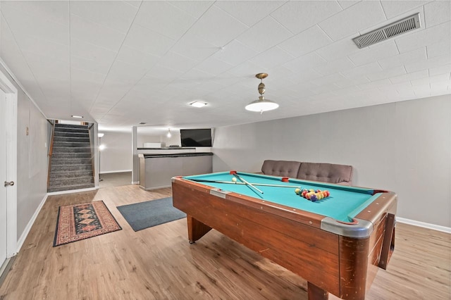 recreation room with billiards and light hardwood / wood-style floors