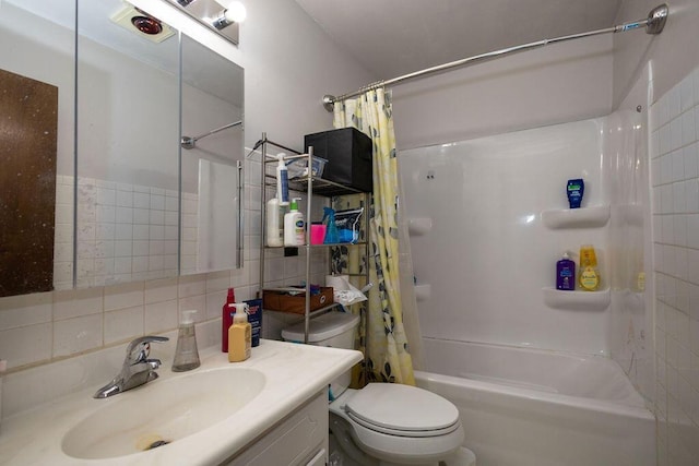 full bathroom featuring shower / bathtub combination with curtain, tile walls, vanity, tasteful backsplash, and toilet