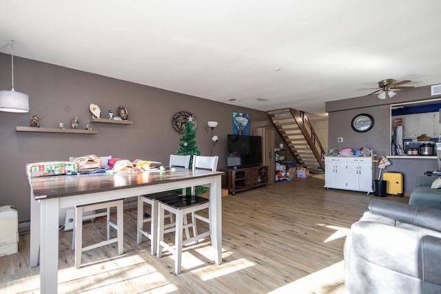 living room with hardwood / wood-style floors and ceiling fan