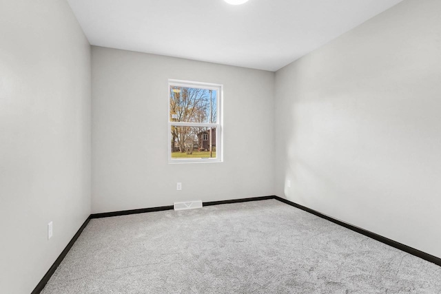 unfurnished room featuring carpet flooring