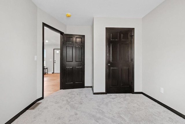 unfurnished bedroom featuring carpet