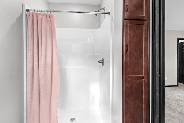 bathroom with a shower with shower curtain