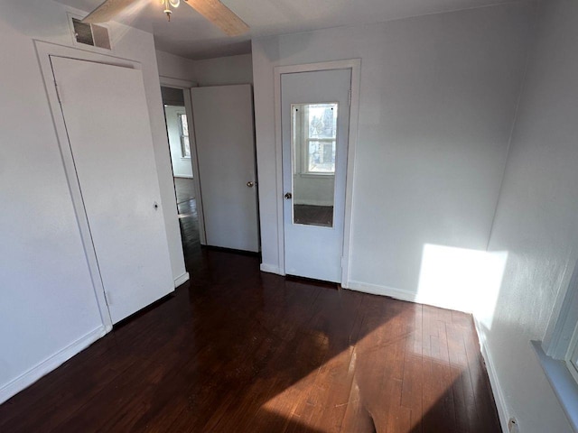 spare room with dark hardwood / wood-style flooring