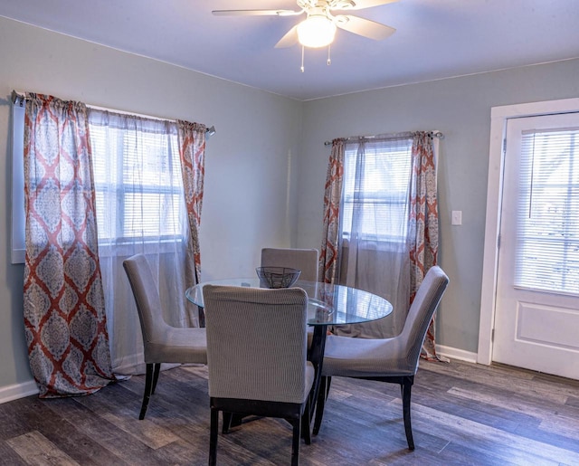 dining space with ceiling fan, a healthy amount of sunlight, and hardwood / wood-style floors