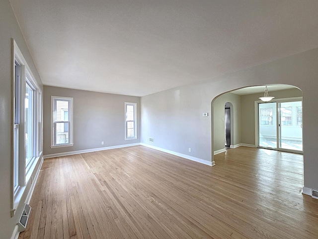 spare room with light hardwood / wood-style floors