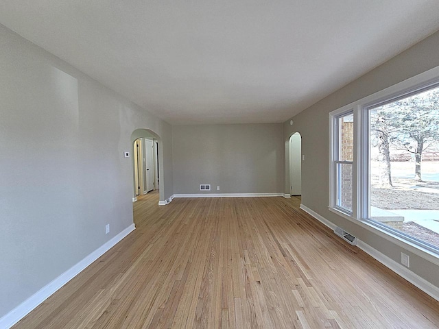 unfurnished room with light wood-type flooring