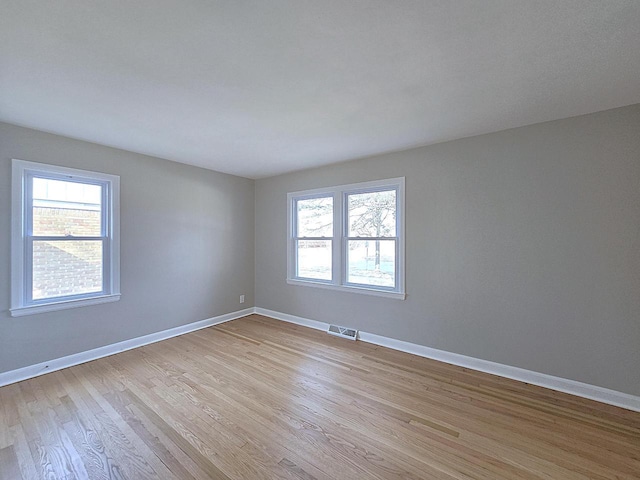 empty room with light wood-type flooring