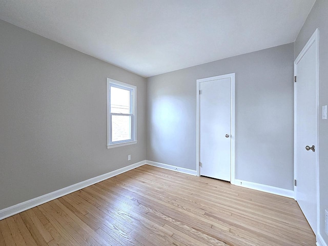 spare room featuring light wood-type flooring