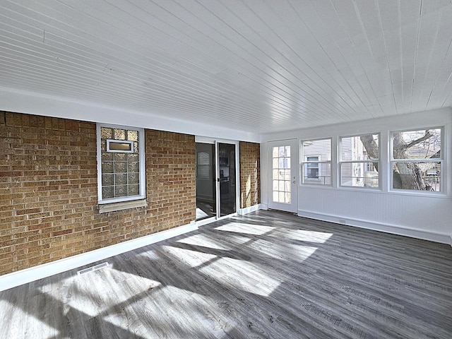 unfurnished sunroom with wood ceiling