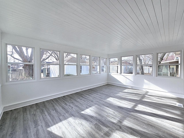 unfurnished sunroom featuring wood ceiling