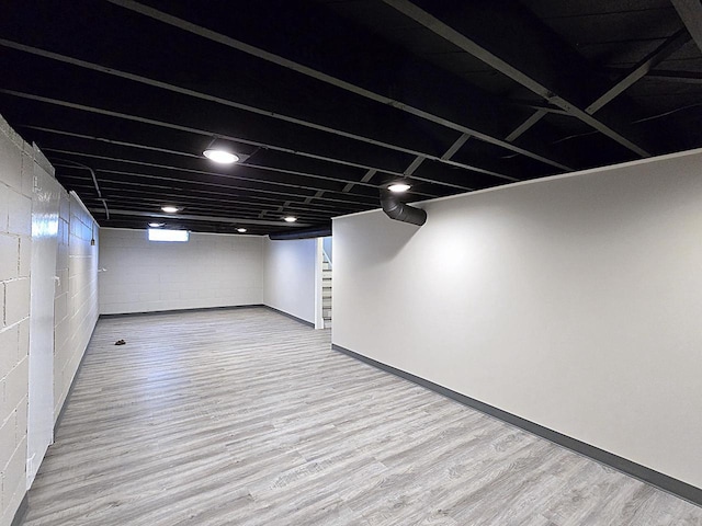 basement with wood-type flooring