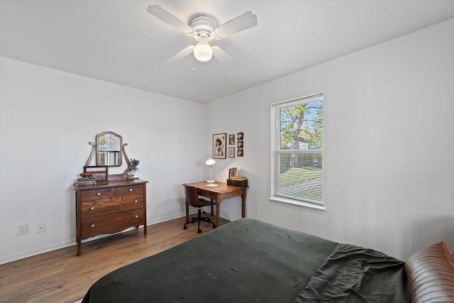 bedroom with hardwood / wood-style floors and ceiling fan