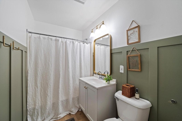 bathroom featuring a shower with curtain, vanity, toilet, and hardwood / wood-style flooring