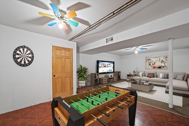 game room featuring ceiling fan and dark parquet floors