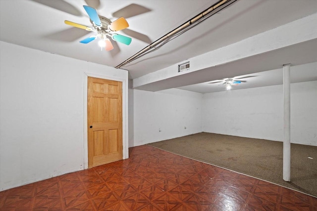 basement featuring dark parquet flooring