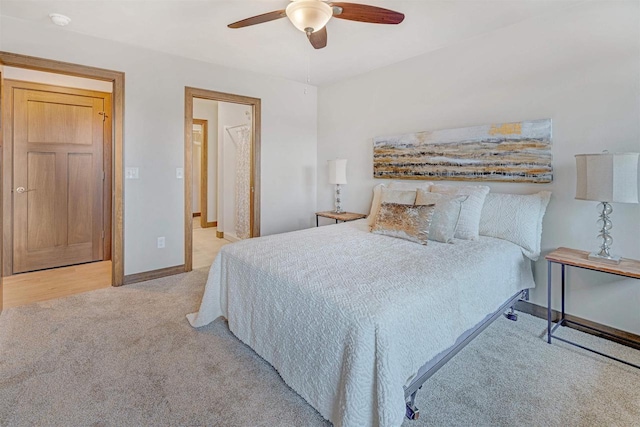 bedroom featuring ceiling fan and light colored carpet