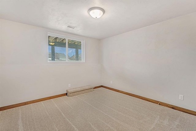 spare room with carpet floors