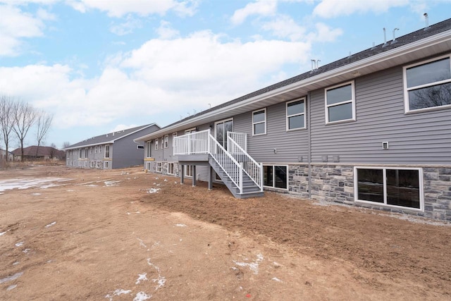 back of house featuring a deck