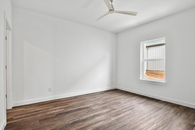 spare room featuring wood-type flooring and ceiling fan