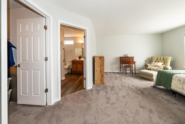 carpeted bedroom with ensuite bath