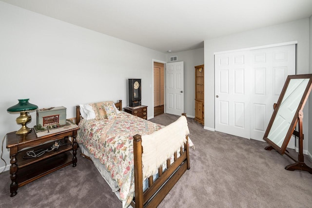 carpeted bedroom with a closet