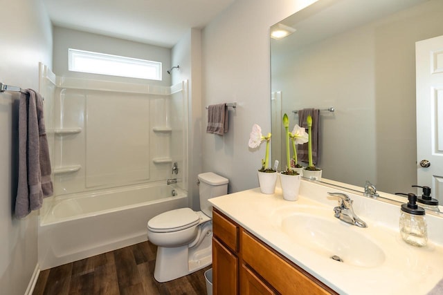 full bathroom featuring shower / washtub combination, hardwood / wood-style floors, vanity, and toilet