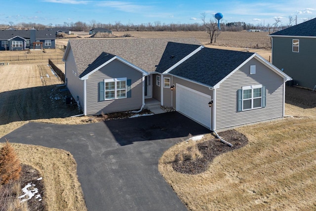 ranch-style house featuring a garage