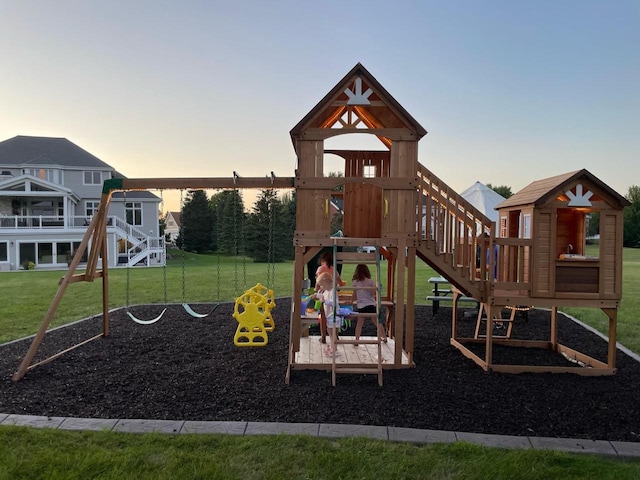 playground at dusk with a lawn