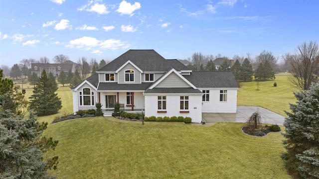 view of front facade featuring a front yard and covered porch