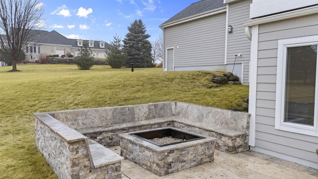 exterior space with an outdoor fire pit and a patio area