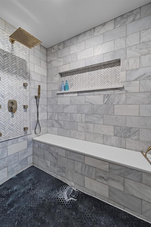 bathroom featuring a tile shower