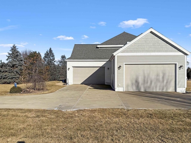 view of home's exterior with a garage and a lawn